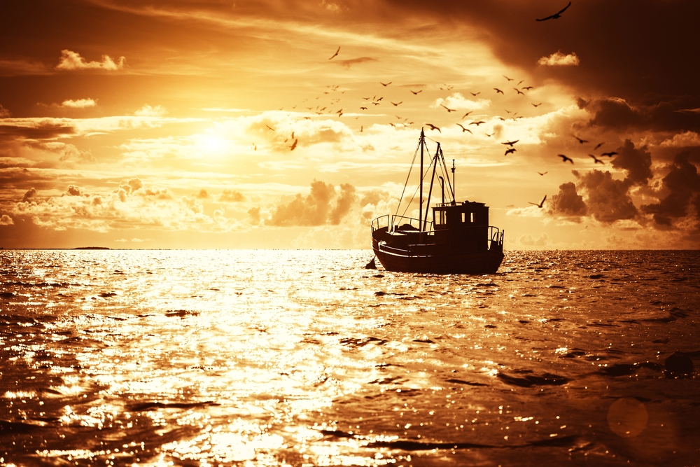 Fishing Trawler sailing into the sunset